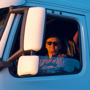 Trucker in cab being reimbursed using TruckLogics' invoicing software solution.