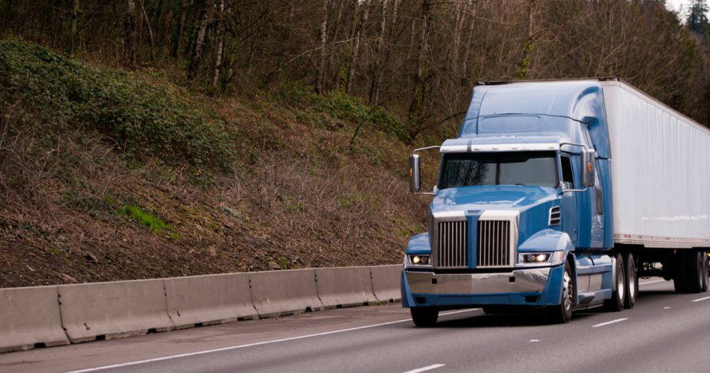 Truck on highway using TruckLogics mobile app trucking management software